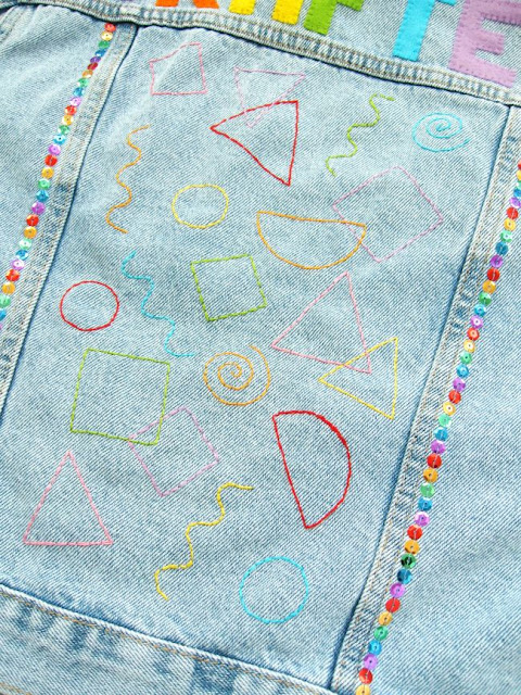 Denim jacket decorated with 90s geometric embroidery