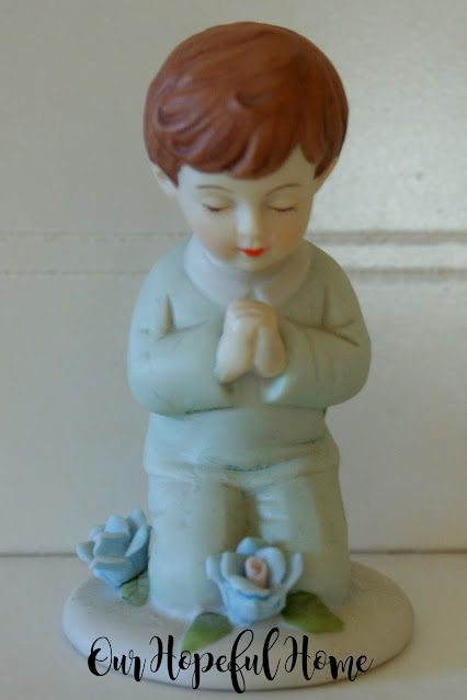 porcelain little boy blue suit kneeling praying