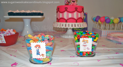 Personalized candy jars with Lalaloopsy pictures.
