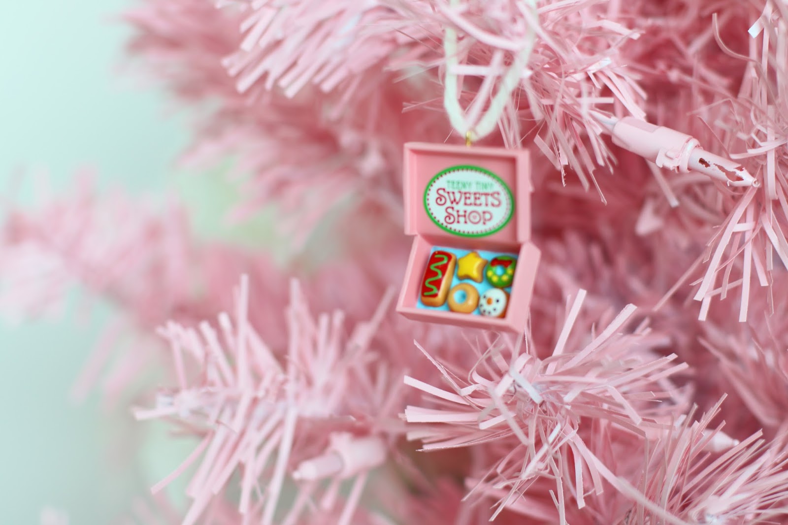 Use spray paint on a white tree to create this pink Christmas tree!