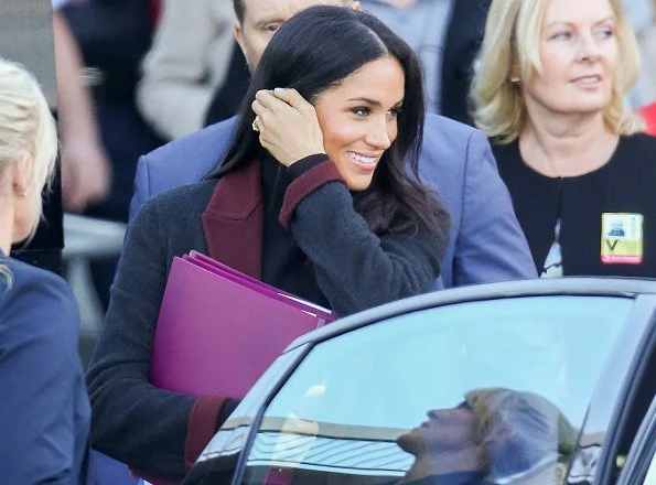 Meghan Markle wore Charcoal black and burgundy double face coat and Sarah Flint Jay tortoiseshell pumps. Prince Harry