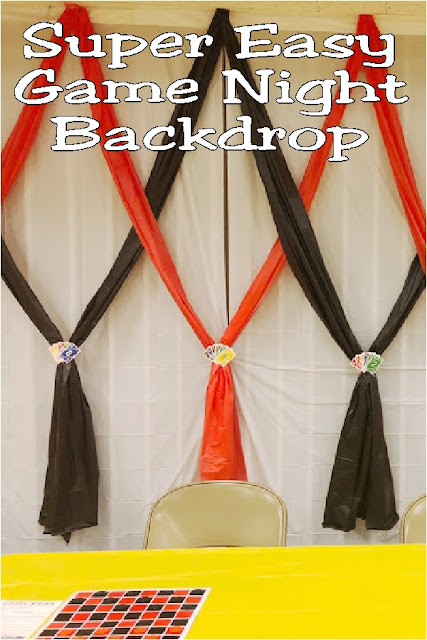 Create a fun accent wall or photo backdrop with this easy backdrop for your Game Night party. Using a few tablecloths and an old pack of Uno cards, you'll have an easy wall that will spark conversation and hide any ugly eyesores at your venue.
