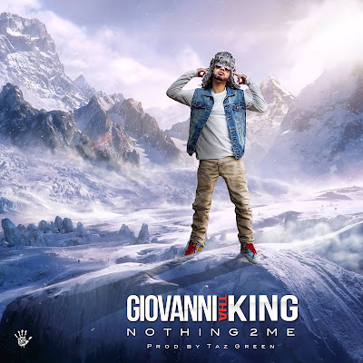 Giovanni Tha King standing on top of a mountain