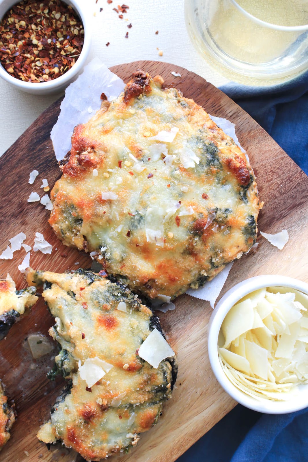 Spinach and Cheese Stuffed Portobello Mushrooms make a rich and decadent side dish or light main dish! The creamy, cheesy filling paired with the earthy mushrooms is ridiculously good!