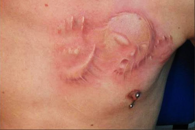 Alien white ink tattoos Alien white ink tattoos