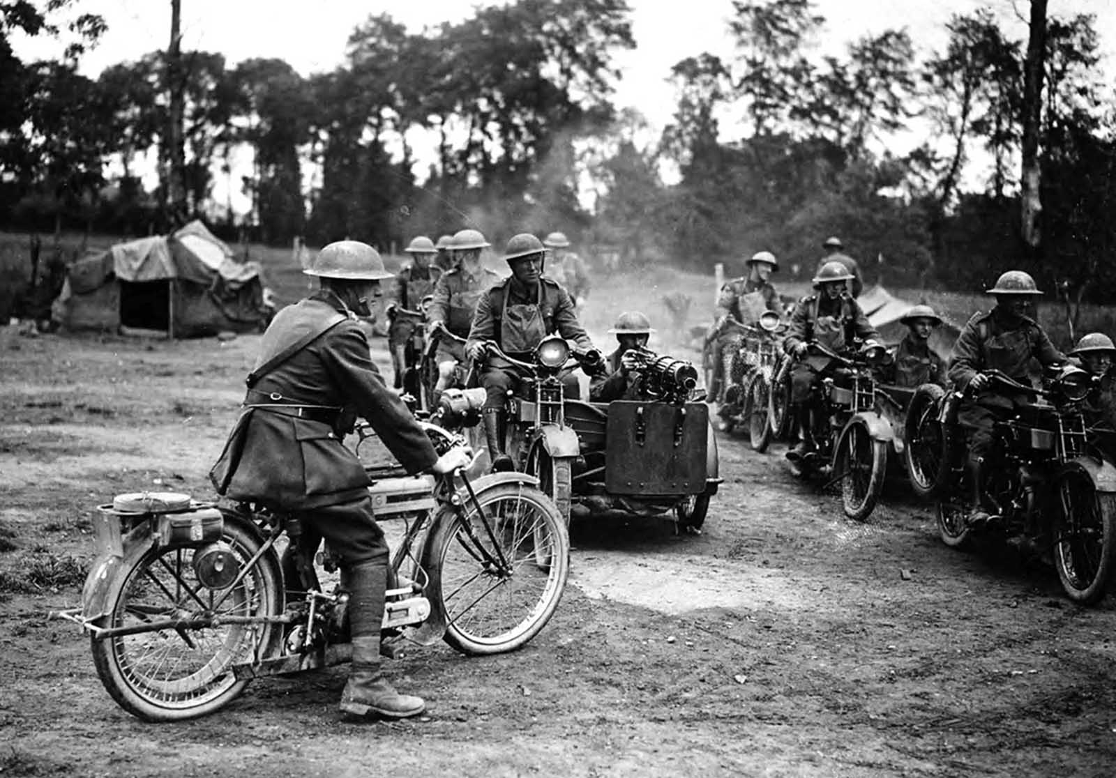 Seven or eight machine-gun crews are ready to set out on a sortie in France, ca. 1918. Each crew consists of two men, the driver on a motorbike and the gunner sitting in an armored sidecar.