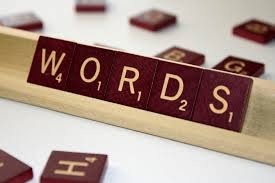 Scrabble tiles in a rack spelling "WORDS"