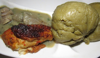 Irish potato fufu served with white soup and peppered chicken