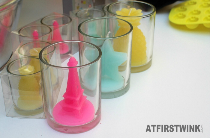 HEMA colorful candles in glass, eiffel tower, star and pineapple shape