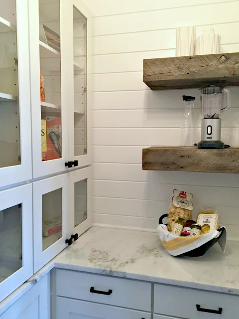 pantry with granite and wood shelves