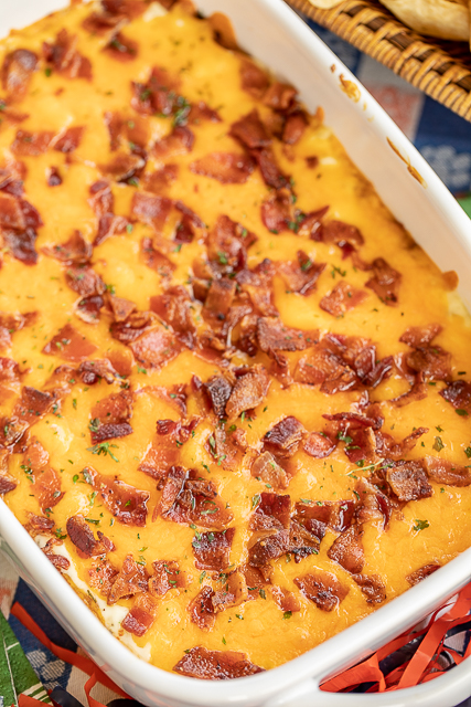 Cracked Out Bean Dip - SO addictive! Bean dip loaded with cheddar bacon and ranch. I could NOT stop eating this yummy dip. The flavors are amazing! Refried beans, taco seasoning, sour cream, ranch, bacon and cheddar cheese. Can make ahead of time and refrigerate until ready to bake. Serve with fritos and tortilla chips. This dip is always the first thing to go at our tailgates! I never have any leftovers! YUM! #dip #beandip #tailgating #appetizer #partyfood Cracked Out Bean Dip - SO addictive! Bean dip loaded with cheddar bacon and ranch. I could NOT stop eating this yummy dip. The flavors are amazing! Refried beans, taco seasoning, sour cream, ranch, bacon and cheddar cheese. Can make ahead of time and refrigerate until ready to bake. Serve with fritos and tortilla chips. This dip is always the first thing to go at our tailgates! I never have any leftovers! YUM! #dip #beandip #tailgating #appetizer #partyfood