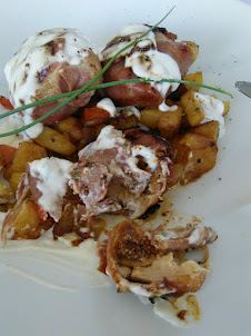 "Turkey Medalimo with figs", a Serbian dish."CRNA maca(Black Cat)" houseboat restaurant in Belgrade