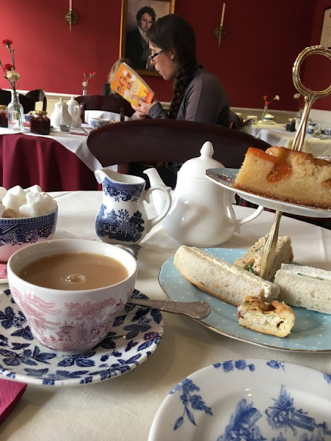 Doings in Bath: tea for one at the Regency Tea Room, in the Jane Austen Centre, Bath, England tea cup, plate, and two-tiered sandwich plate