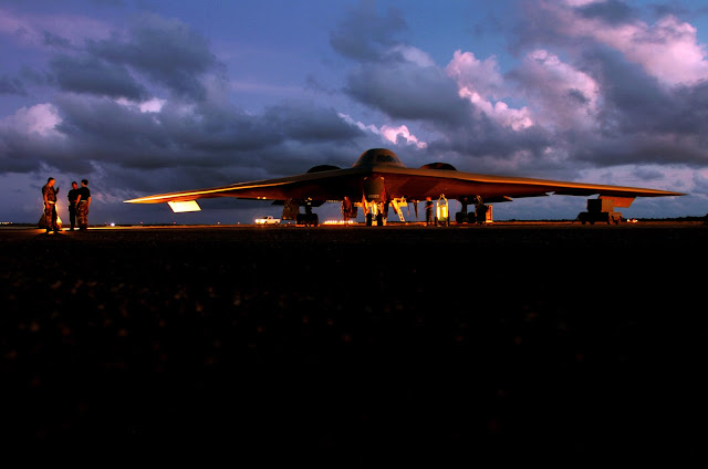 A B-2 Spirit bomber is prepared for a morning mission at Anderson Air Force Base, Guam.