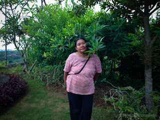 Woman Traveler Enjoy A Holiday Among Fresh Green Leaves Of The Tree In The Garden North Bali Indonesia