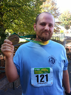 Lance with finisher medal after his first marathon.