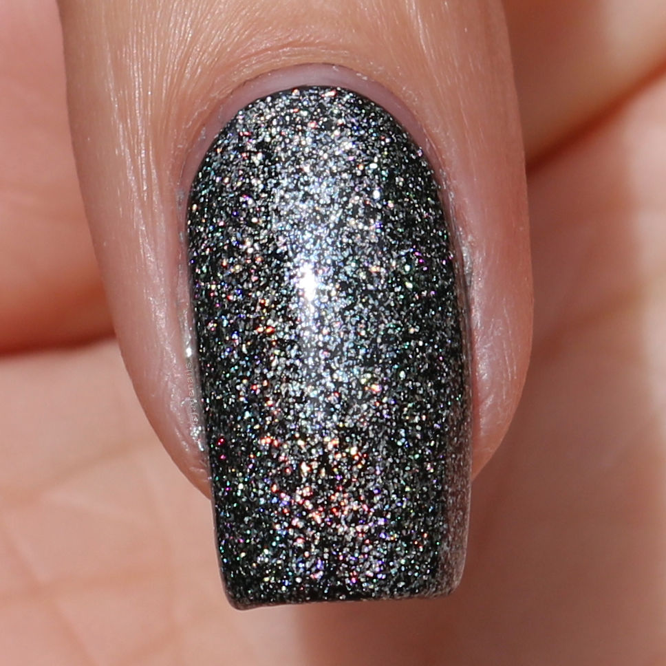 OPI Tinker, Thinker, Winker? (over black) swatched by Olivia Jade Nails