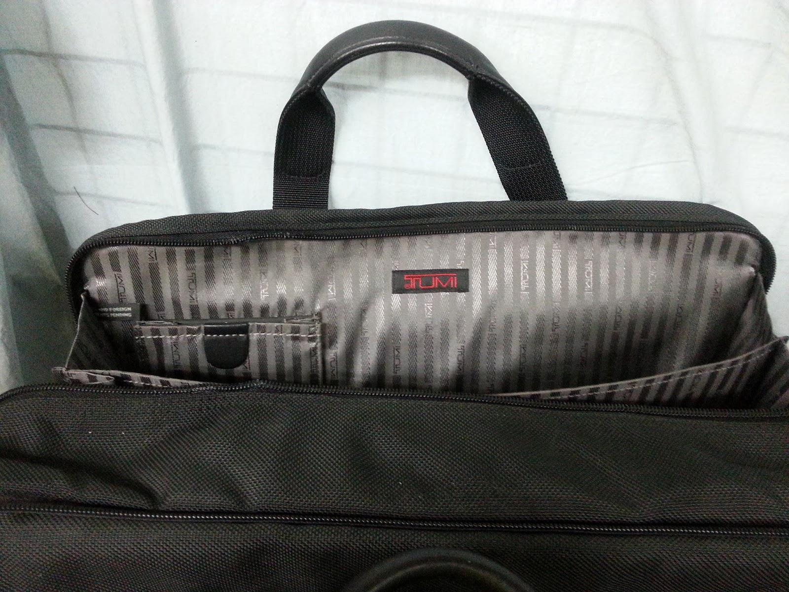 Tumi Bag Repair, tumi luggage wheel replacement, zipper repair, bag