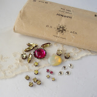 new and old glass and crystal glass rhinestones in dark pink and yellow