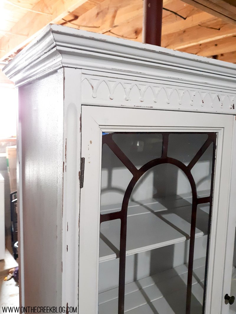 A makeover of a hutch from the Habitat For Humanity ReStore!  The hutch is painted in a chippy white with red accents!