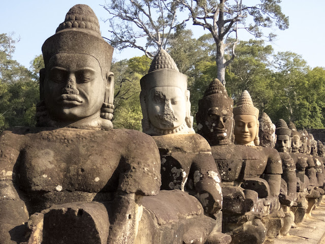 Gods lining the entrance to Angkor Thom City in Cambodia