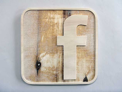 Facebook F logo rendered in 3D from routered wood