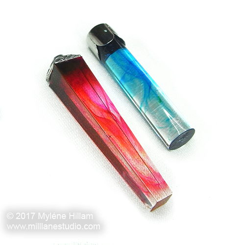 Geometric resin pendants filled with wispy streaks of red and turquoise