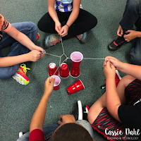 Students playing the cup stacking game in action