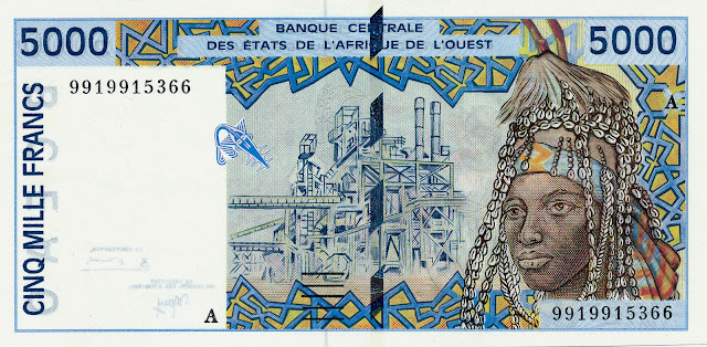 West African States Currency 5000 CFA Francs banknote 1999 Portrait of a young african woman wearing headdress adorned with cowrie shells