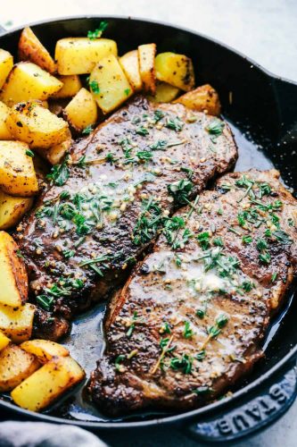 Skillet Garlic Butter Herb Steak and Potatoes is pan seared and cooked to perfection and topped with a garlic herb butter compound.  This is the best steak that I have ever had!! 