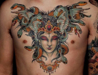 Lady with a lot of snakes on her head looking very surprising. This tattoo also comes under the ill Medusa category of tattoos