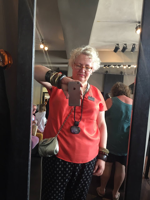 Kaffesoester trying jewellery at Monies sale Kaffesoester trying jewellery at Monies sale