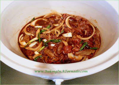Crockpot Oriental Steak: An easy crockpot dinner loaded with oriental flavors. The steak is marinated, sliced and cooked slowly for 4 to 6 hours for an easy meal. | Recipe developed by www.BakingInATornado.com | #recipe #dinner #crockpot