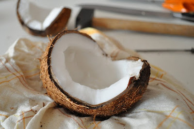 A coconut that's been freshly cracked open.