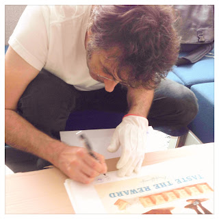 Cesare Asaro signing one of the Oberffafendorfer prints for the Curio & Co. - Let's Play art at Atelier Olschinsky Art Store (Curio and Co. OG - www.curioandco.com )