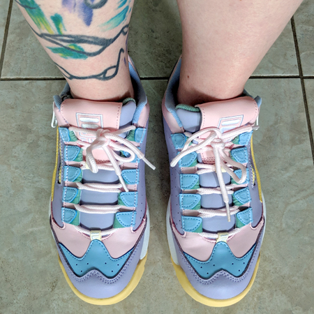 image of my feet clad in pink, purple, blue, and yellow pastel sneakers