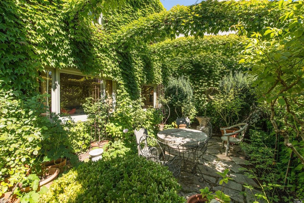 Ivy covered California home of Myra Hoefer with lush gardens and French inspired interiors