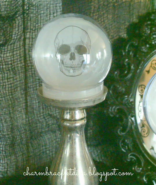 skull on candlestick globe orb