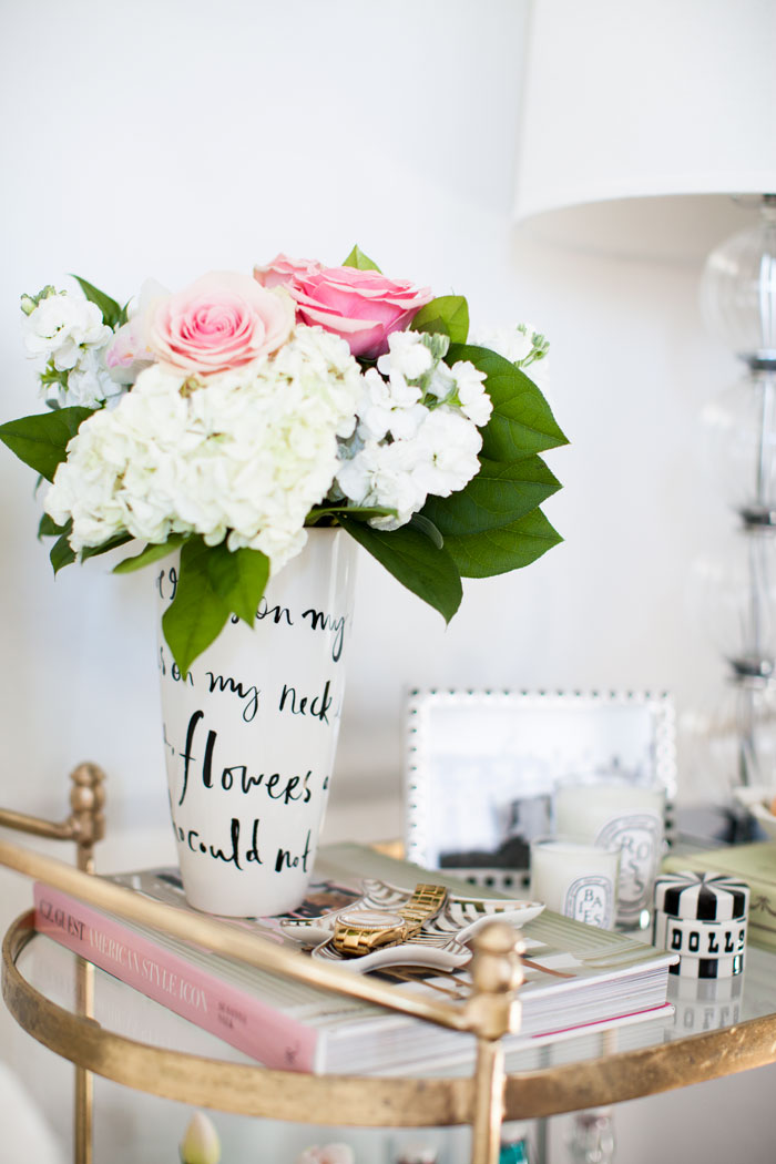 A gold bar cart makes a charming and creative bedside table. {Décor