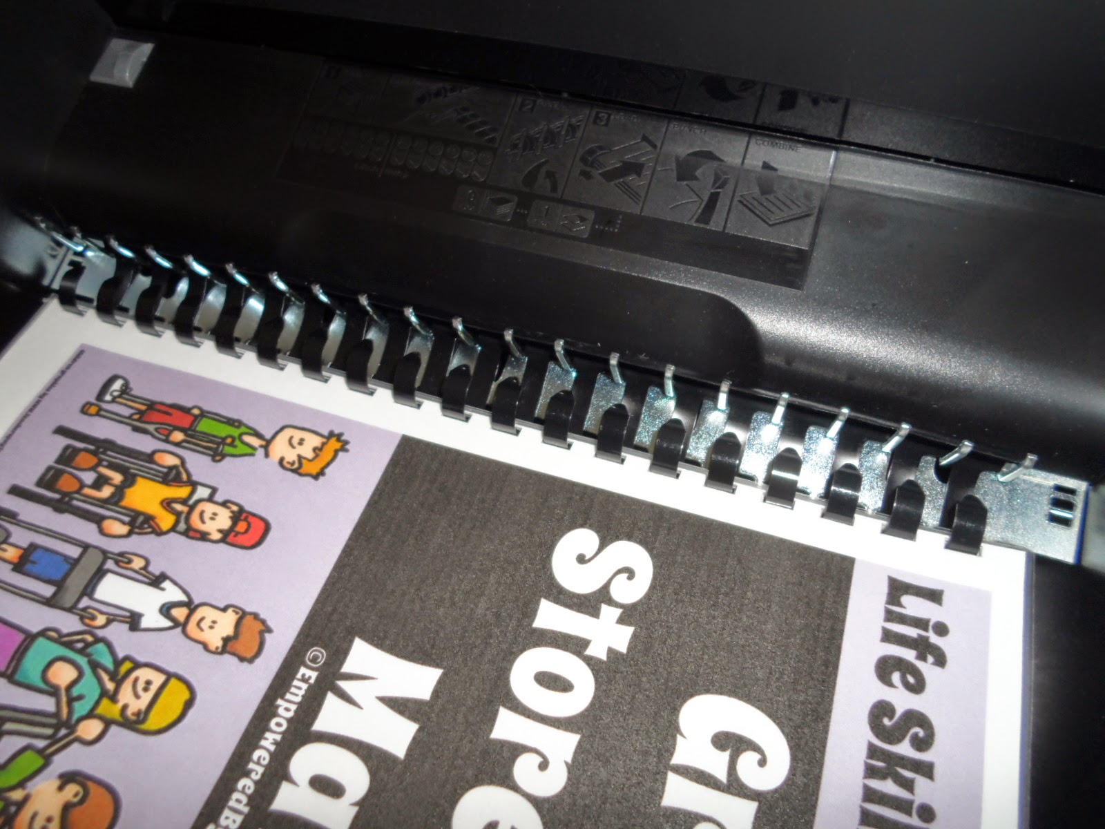 Empowered By THEM Comb Binding A Book