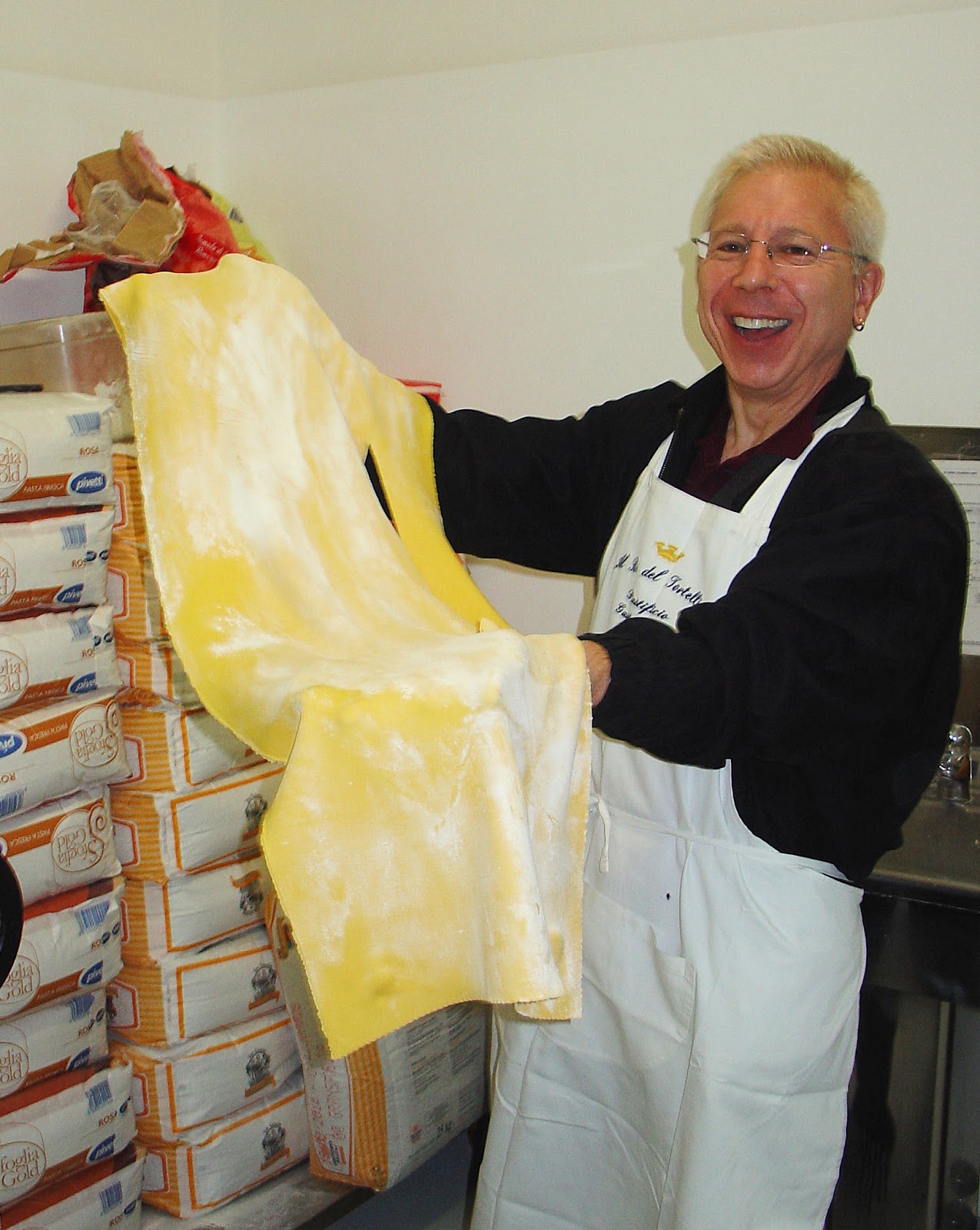 Humongous pressed sheets of tortellini dough are ready for the table.