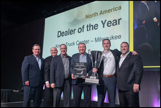 Mack Trucks named Kriete Truck Center of Milwaukee, Wisconsin its 2018 North American Dealer of the Year. Mack made the announcement during its annual dealer meeting, which brings together dealer leadership from the U.S. and Canada. From left to right: Martin Weissburg, president, Mack Trucks and member, Volvo Group Executive Board; Joseph Favia, regional vice president – central region, Mack Trucks; David Barletta, executive vice president and director, Mack truck sales, Kriete Group; Marty Dudenhoeffer, executive vice president, dealer operations, Kriete Group; David Kriete, owner, Kriete Group; Jonathan Randall, senior vice president, North American sales and marketing, Mack Trucks.