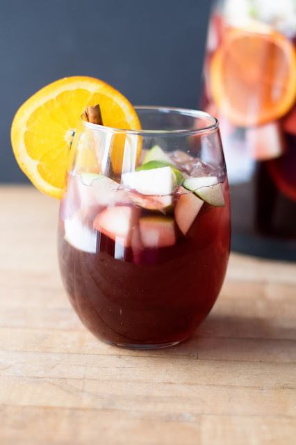 A glass of the Simple Sangria in from of the finished pitcher.  