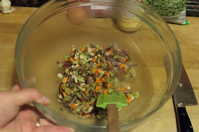 The sauteed vegetables in a mixing bowl. 