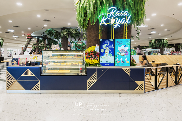 Sunway pyramid rasa royal kiosk in royal blue color and mid tone wood texture for an outstanding corporate identity
