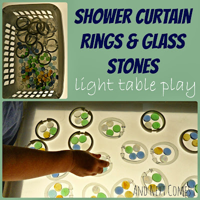 A simple invitation to play on the light table using shower curtain rings and glass stones from And Next Comes L