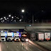 Police Trucks Parked Under A Bridge To Prevent A Man From Committing Suicide
