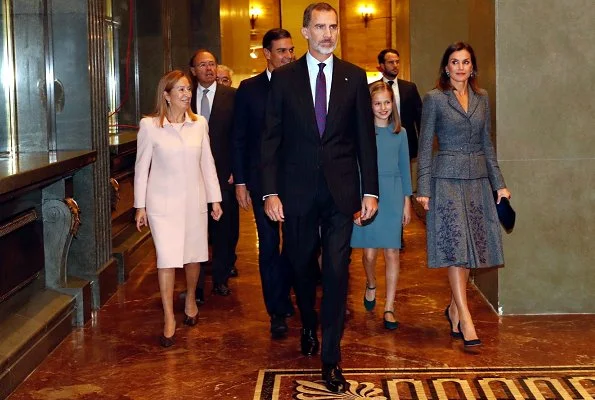 Queen Letizia wore Felipe Varela suit and Magrit Pumps, carried Hugo Boss Fanila clutch bag, Leonor and Sophia Carolina herrera dress