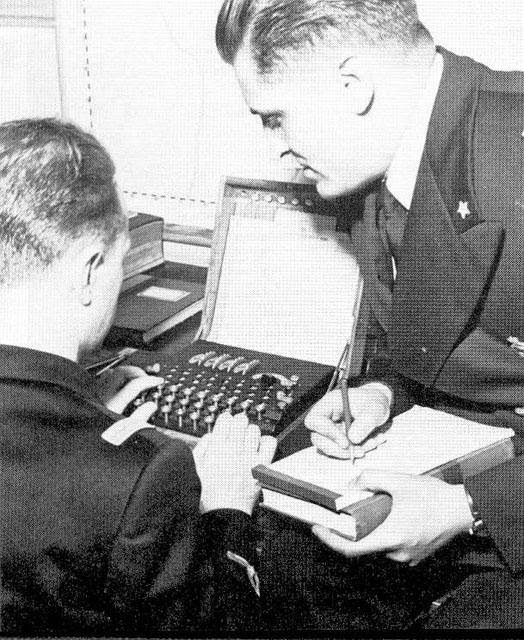 Italian cryptographers use an Enigma machine worldwartwo.filminspector.com