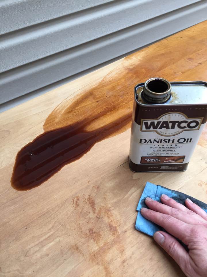 Applying Danish Oil to wood table top. Applying Danish Oil to wood table top.